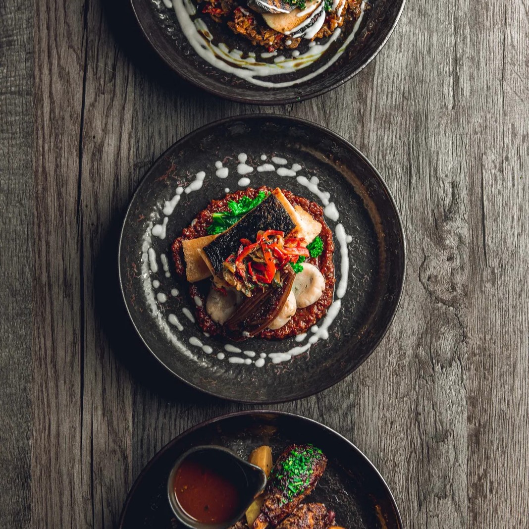 Three plates with food on it